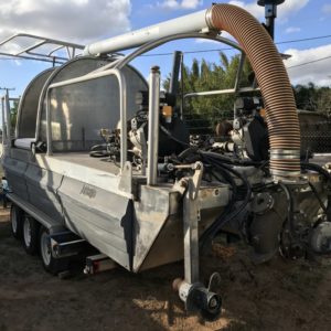 AQUATIC WEED HARVESTER BOAT ON TRI AXLE TRAILER